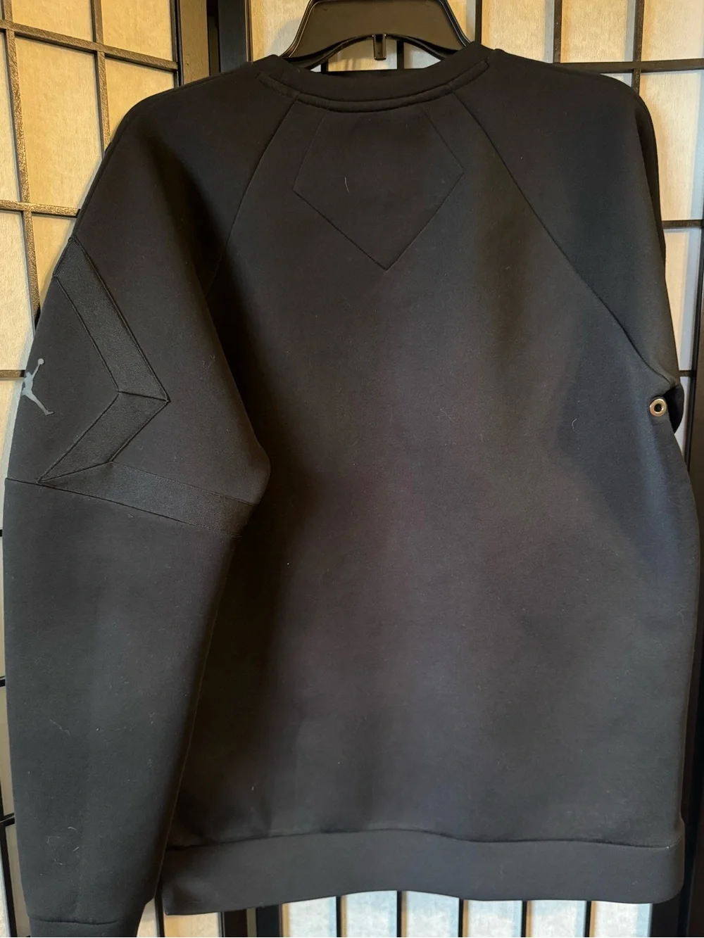 Jordan Sportswear Flight Tech Shield Crewneck Sweatshirt in black.